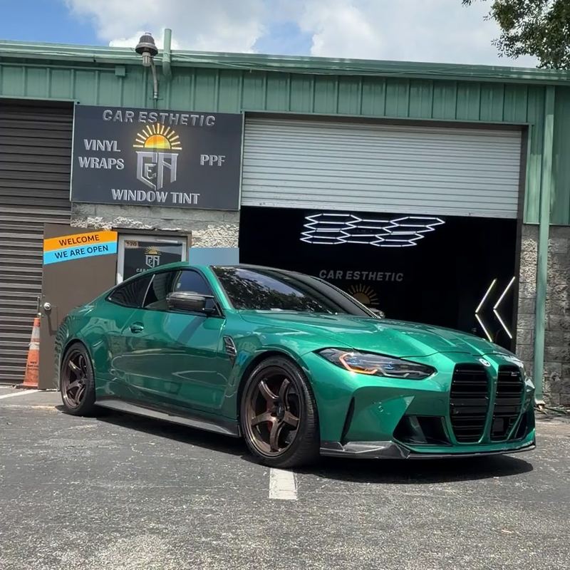 Car Esthetic Auto shop exterior in Orlando with its sign and open install bay