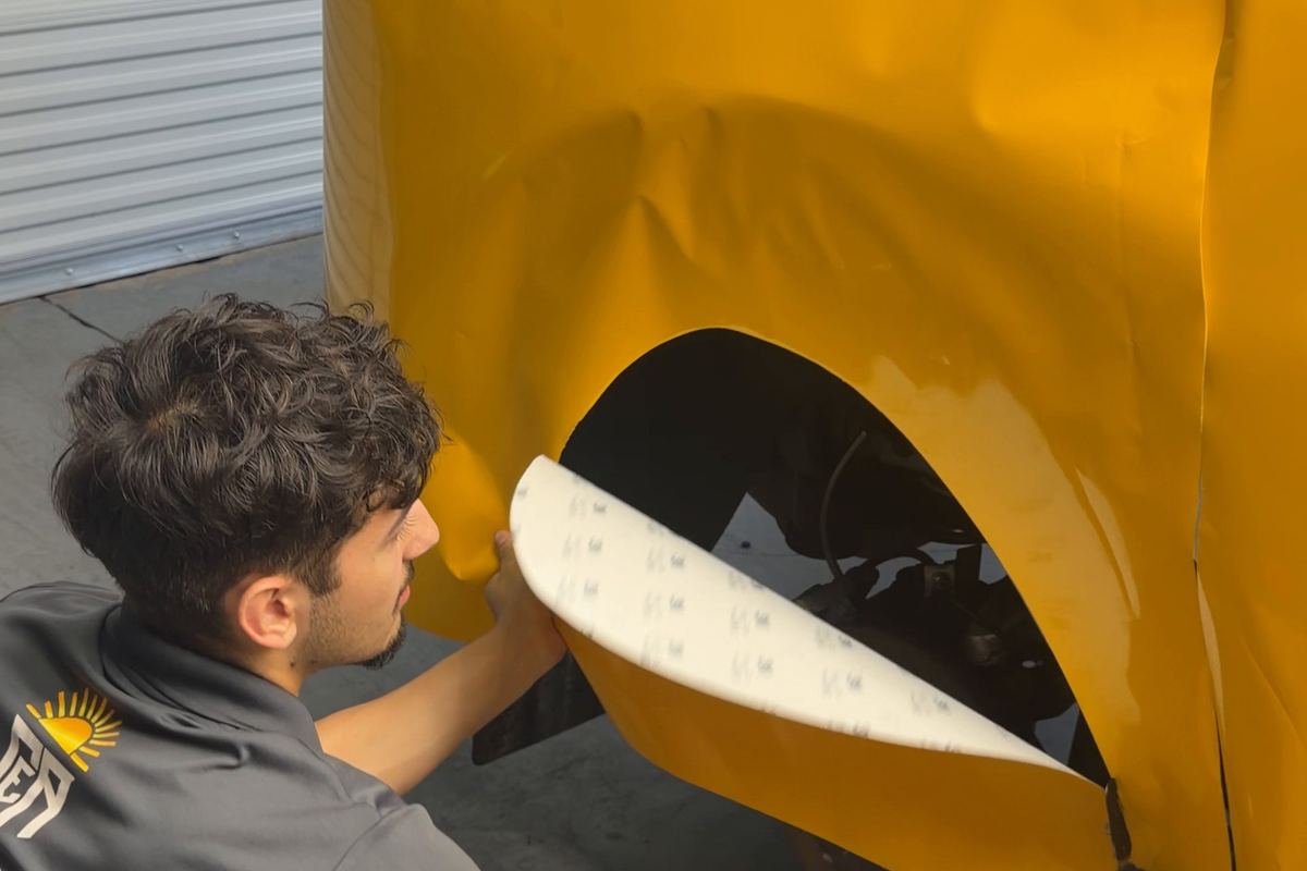 Installing a yellow color change wrap on a Mitsubishi Outlander