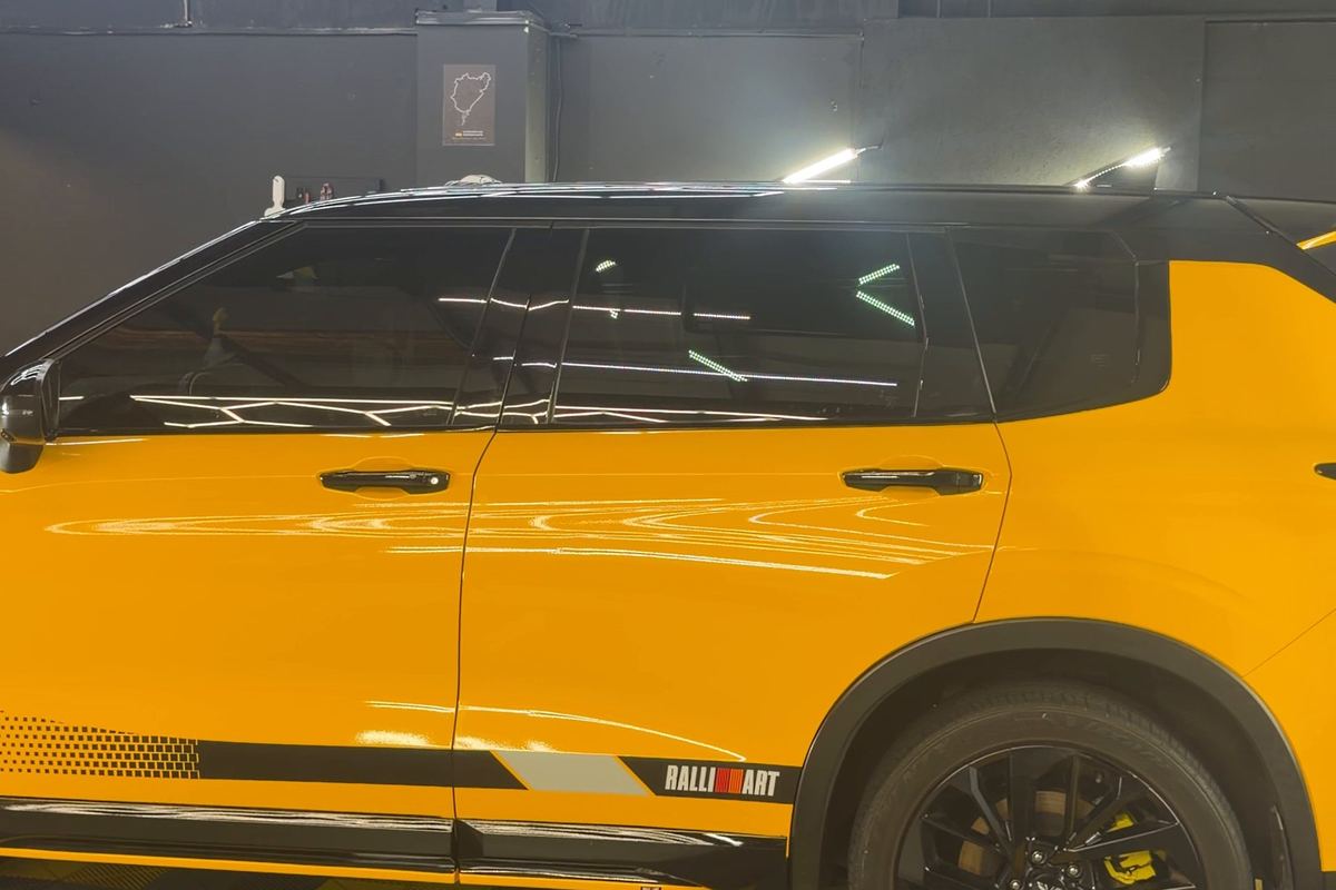 Yellow Mitsubishi Outlander with a color change wrap